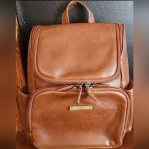 This brown Vegan  leather backpack is a stylish and functional accessory